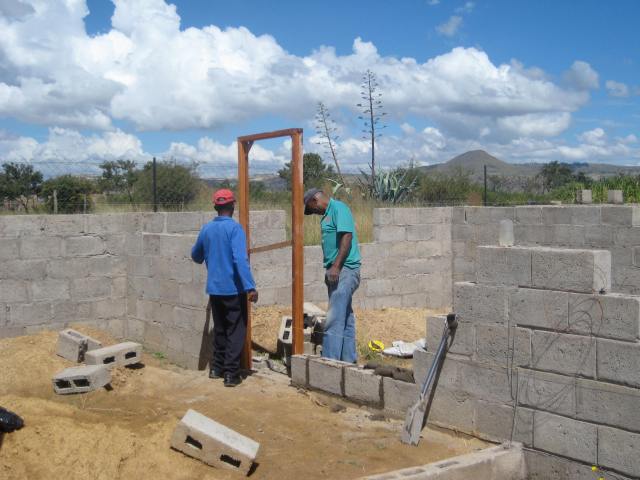 The first door frame to go in was the one between the garage and kitchen. It was a gift from our friends in Joburg!