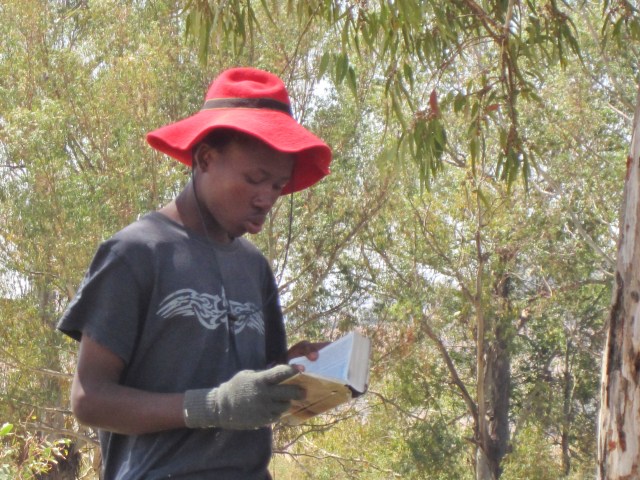 Program leader Kheola reading Hebrews 11:1